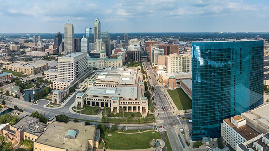 Downtown Indianapolis can be seen on a mostly sunny day in this aerial shot.